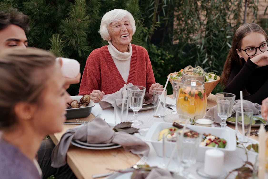 residents sat round the table laughing