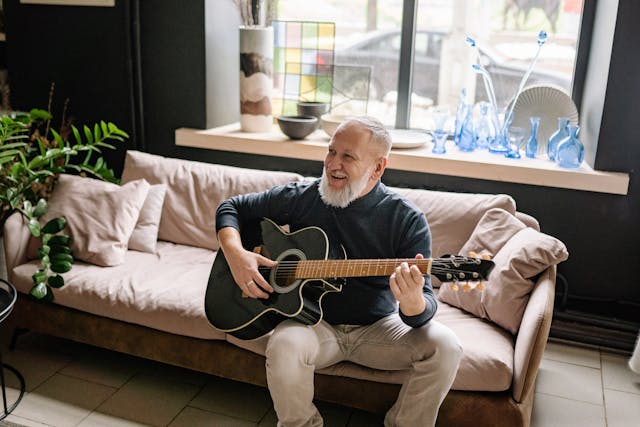 resident playing the guitar