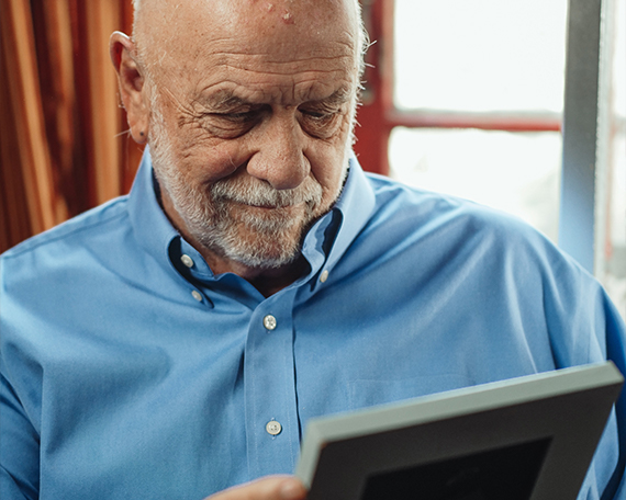 resident looking at photo