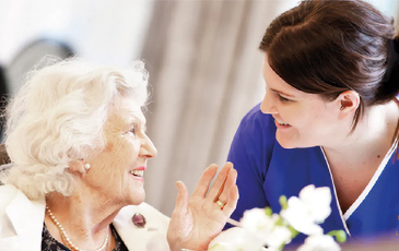 resident chatting with carer