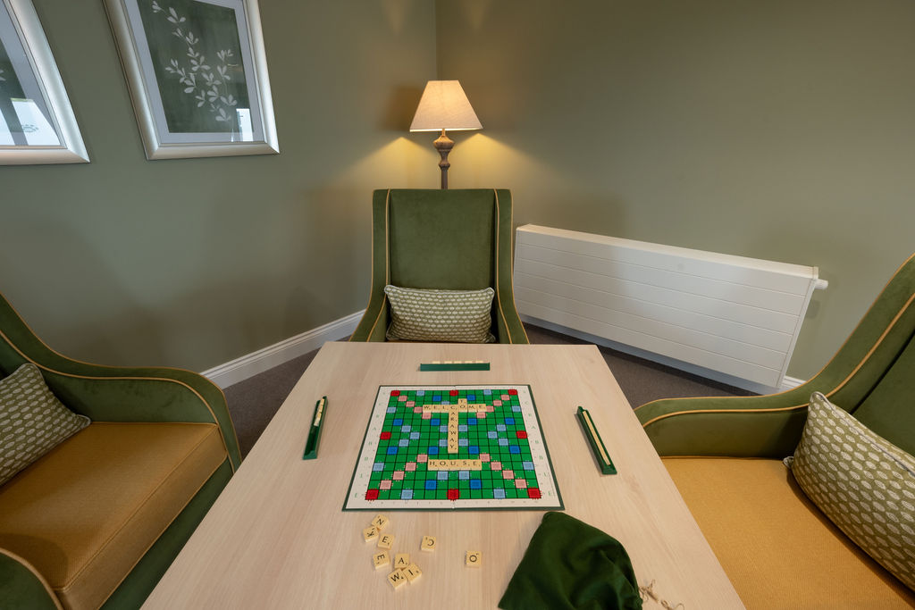 scrabble board in game chair corner