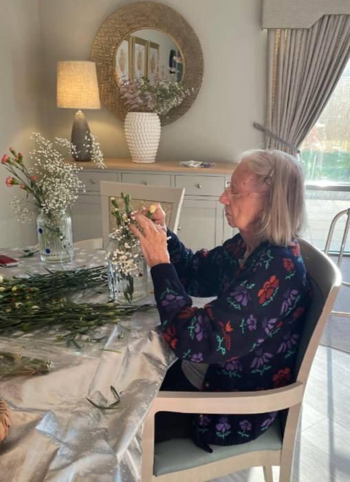 resident doing flower arranging