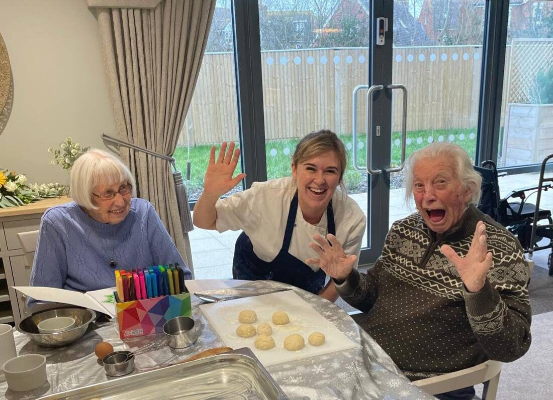 residents doing baking with one of our chefs