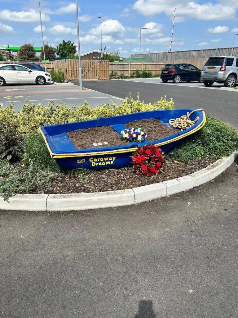our boat planter with wreaths on