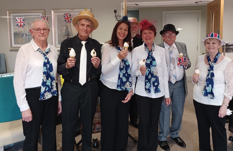 our VE day visitors with ice creams in their hands smiling