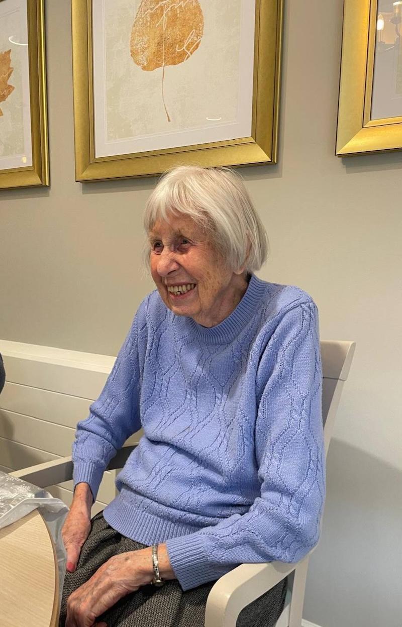 resident called mary sat in a chair smiling
