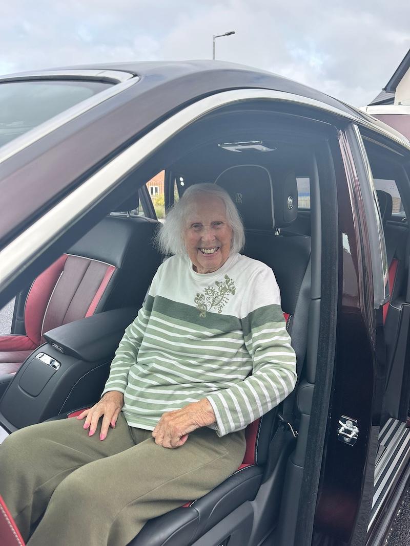 one of our residents in a rolls royce