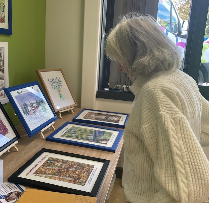 resident on an outing looking at paintings
