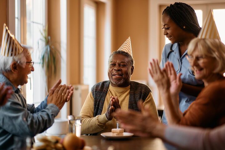 residents celebrating a birthday in a care home