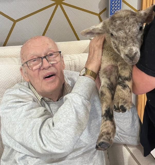 resident with a goat