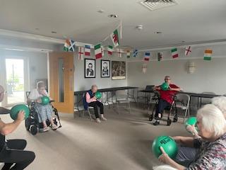 residents with balls doing games