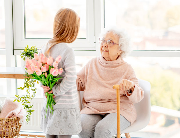 resident and child with flowers