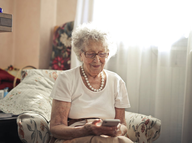 resident looking at her phone